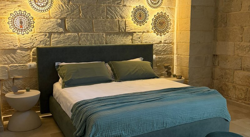 La camera da letto dell'appartamento Malìa