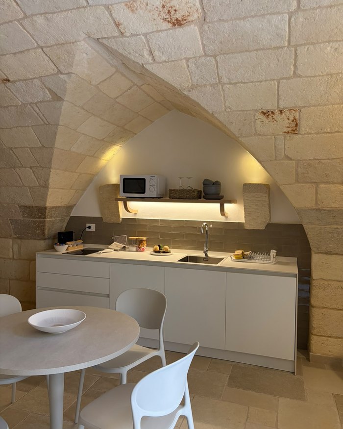L'angolo cottura e la zona pranzo dell'appartamento Malìa